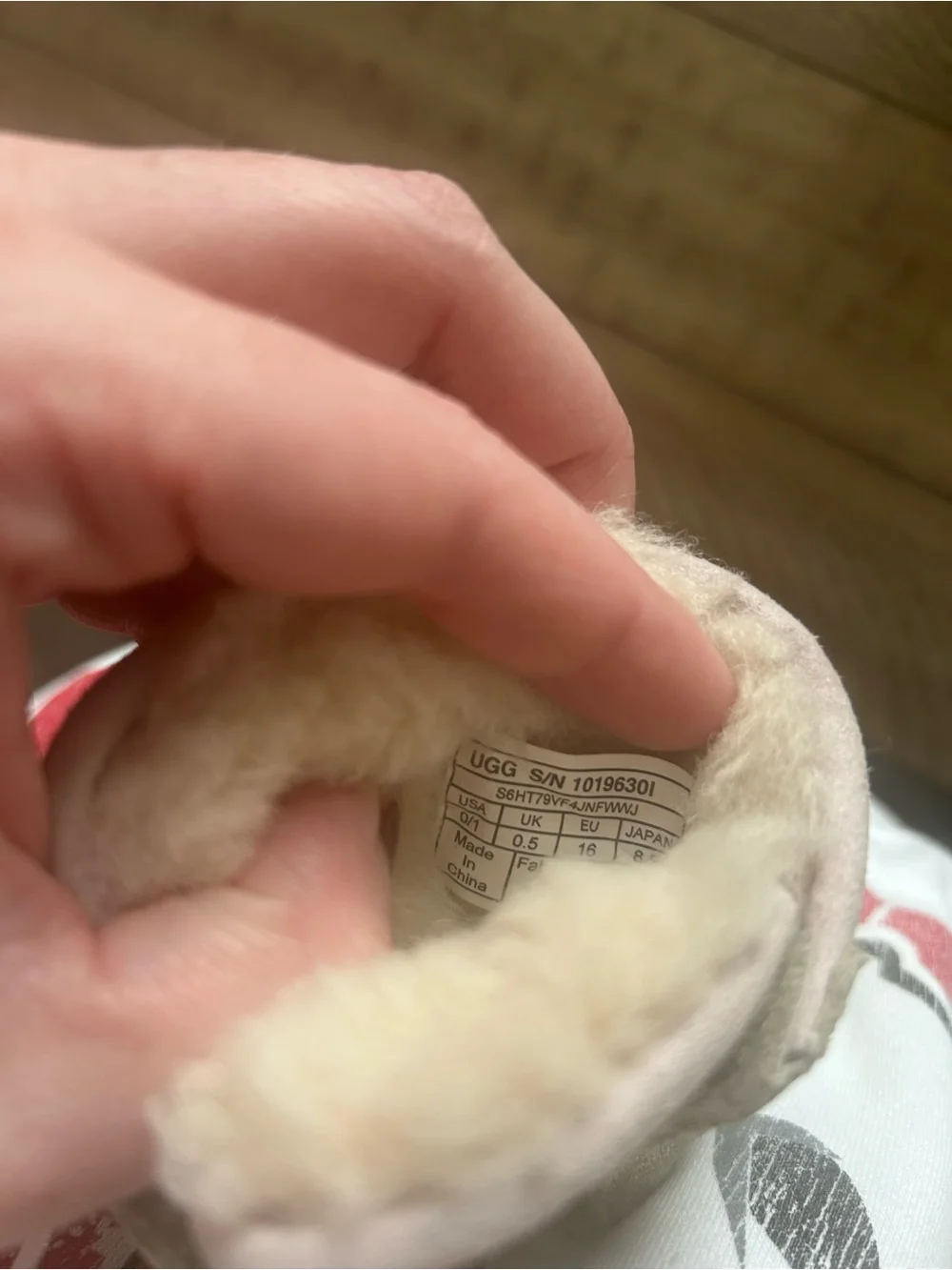 Size 0/1 UGG booties with bow